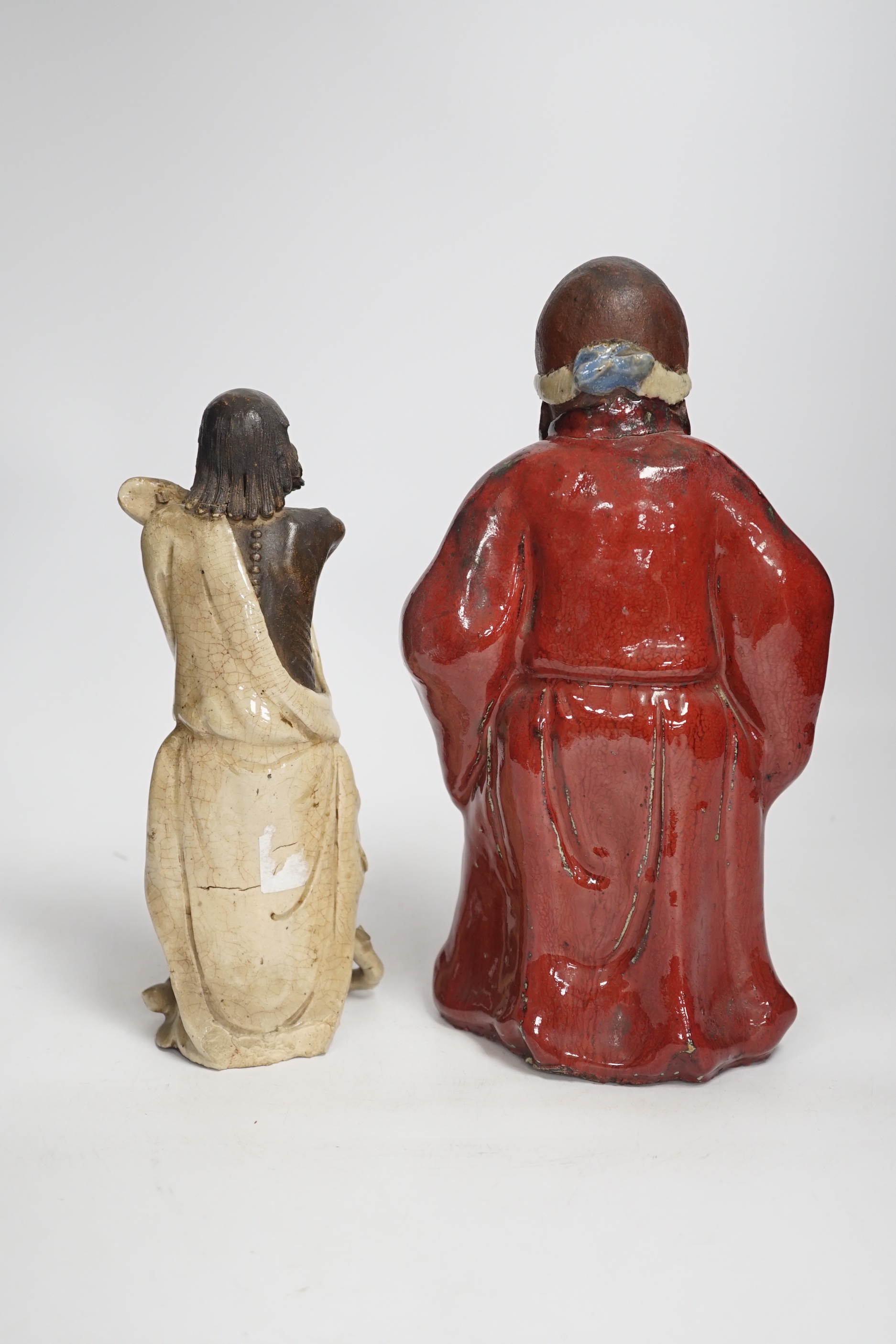 Two Chinese Shiwan pottery figures, largest 27cm high